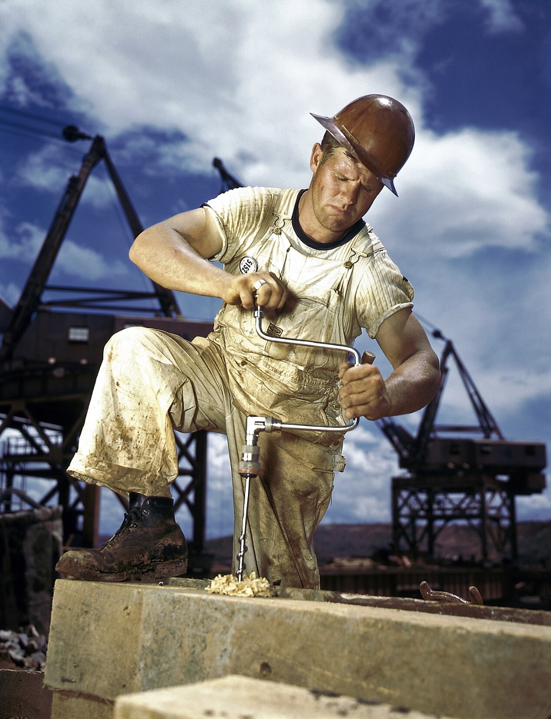 A carpenter, wearing a contractor's employee badge, at work during the construction of Douglas Dam in East Tennessee 